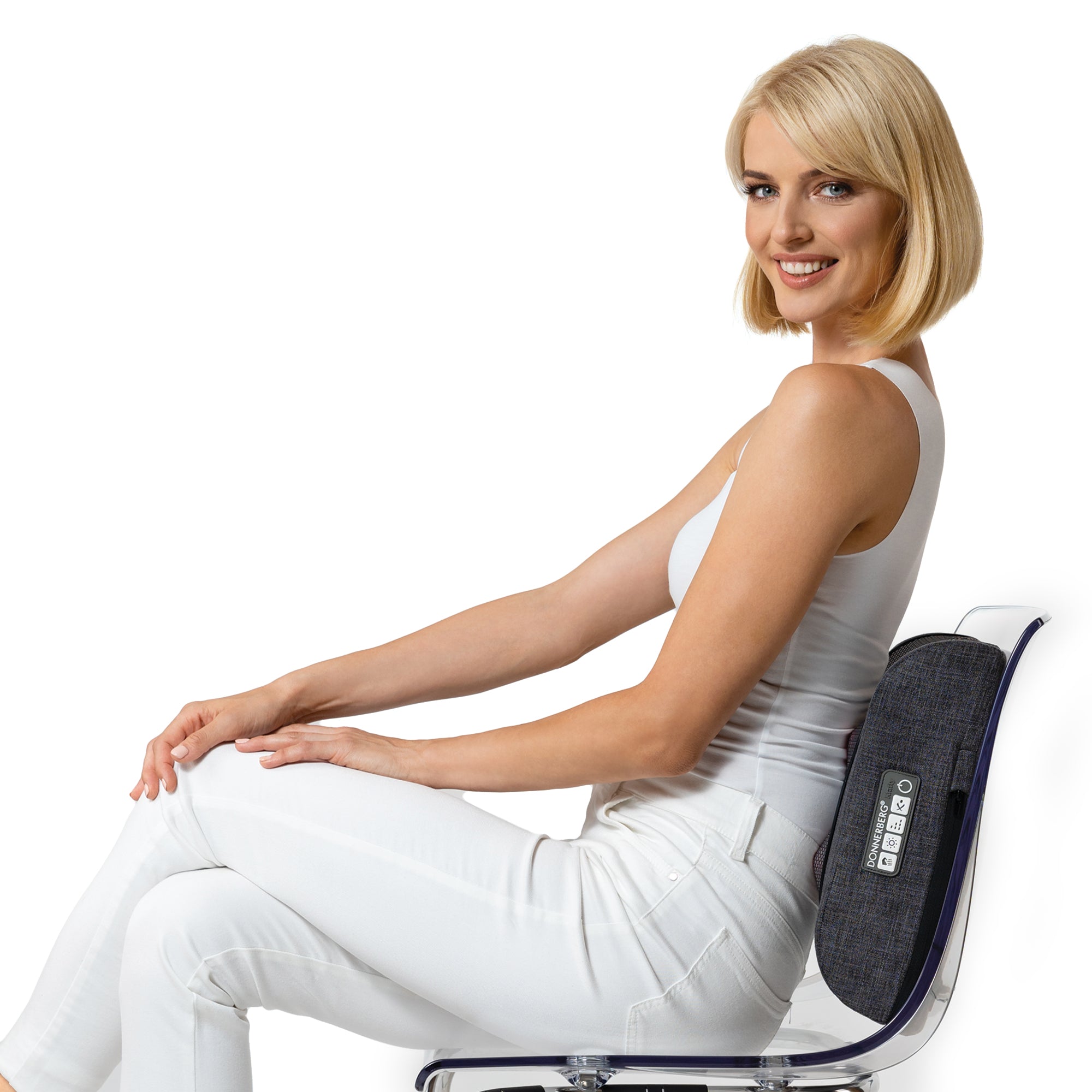 Woman sitting on chair and using back massager