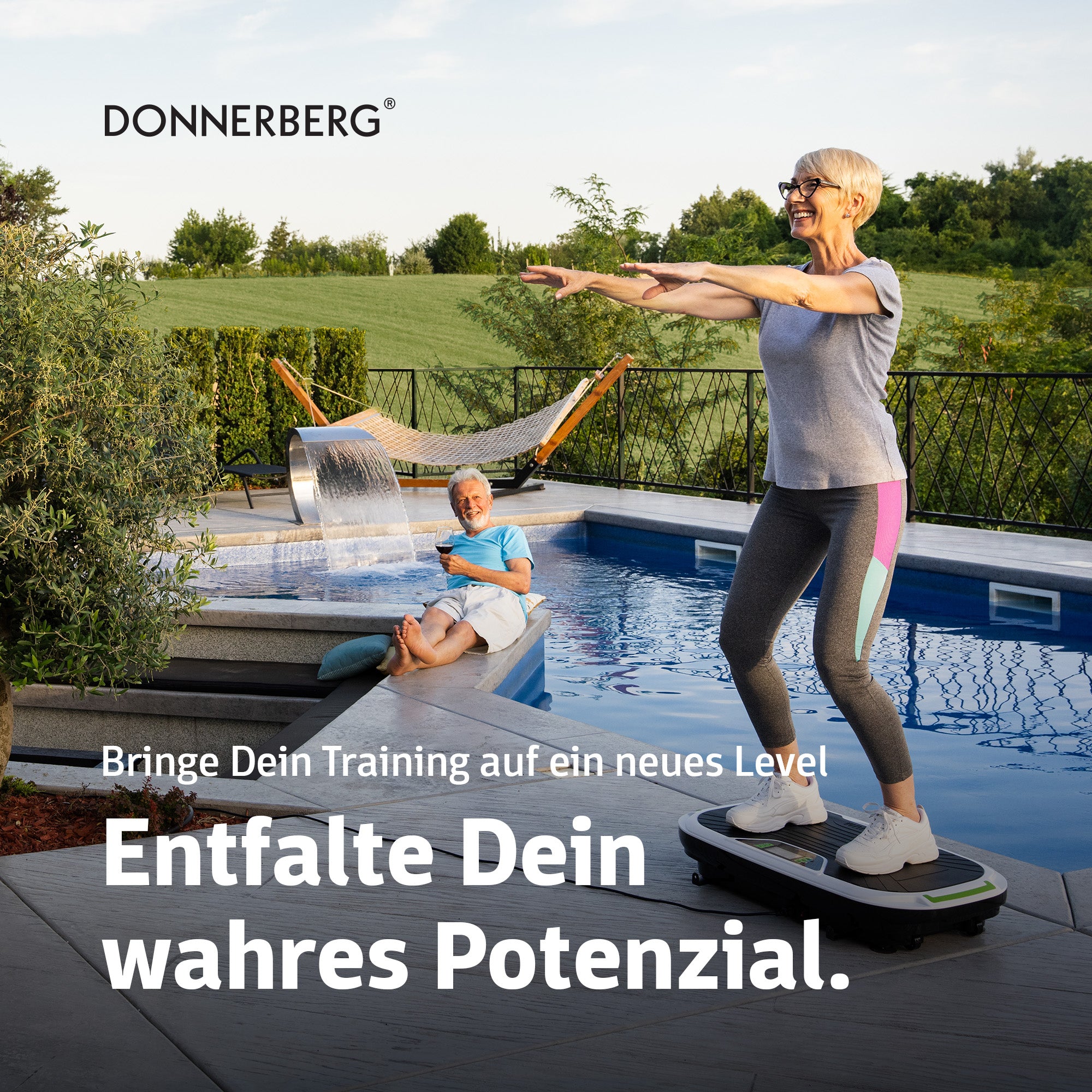 Woman exercising on vibration plate in her garden next to swimming pool