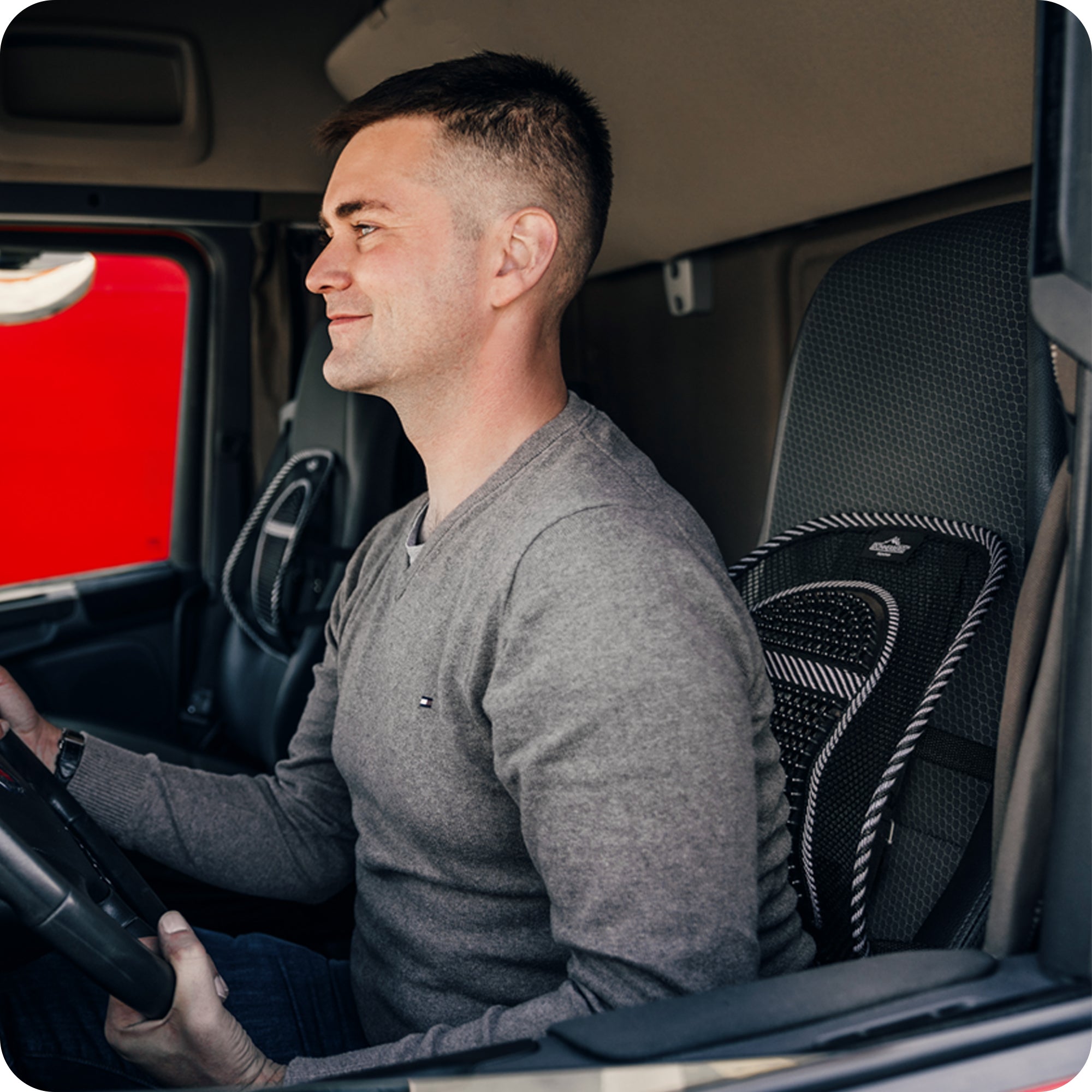 truck driver sitting on seat with back support for comfortable journey