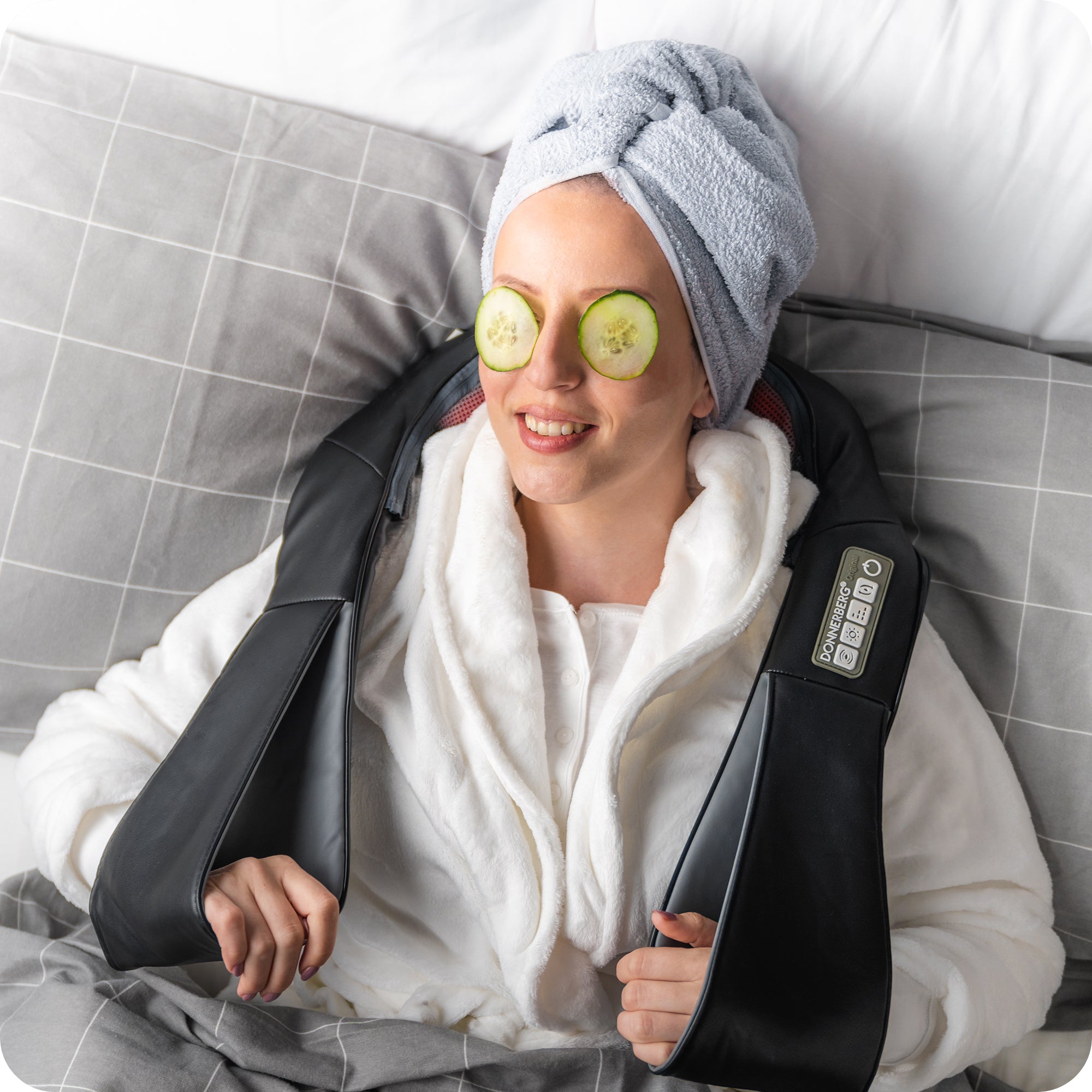 woman experiencing relaxation and relief with a portable neck massager while resting on a bed