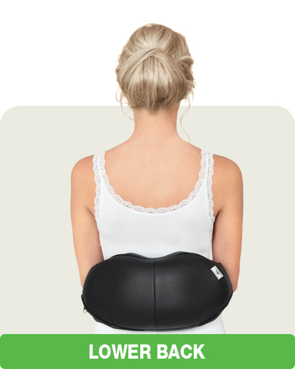 woman using U shaped massager on her back
