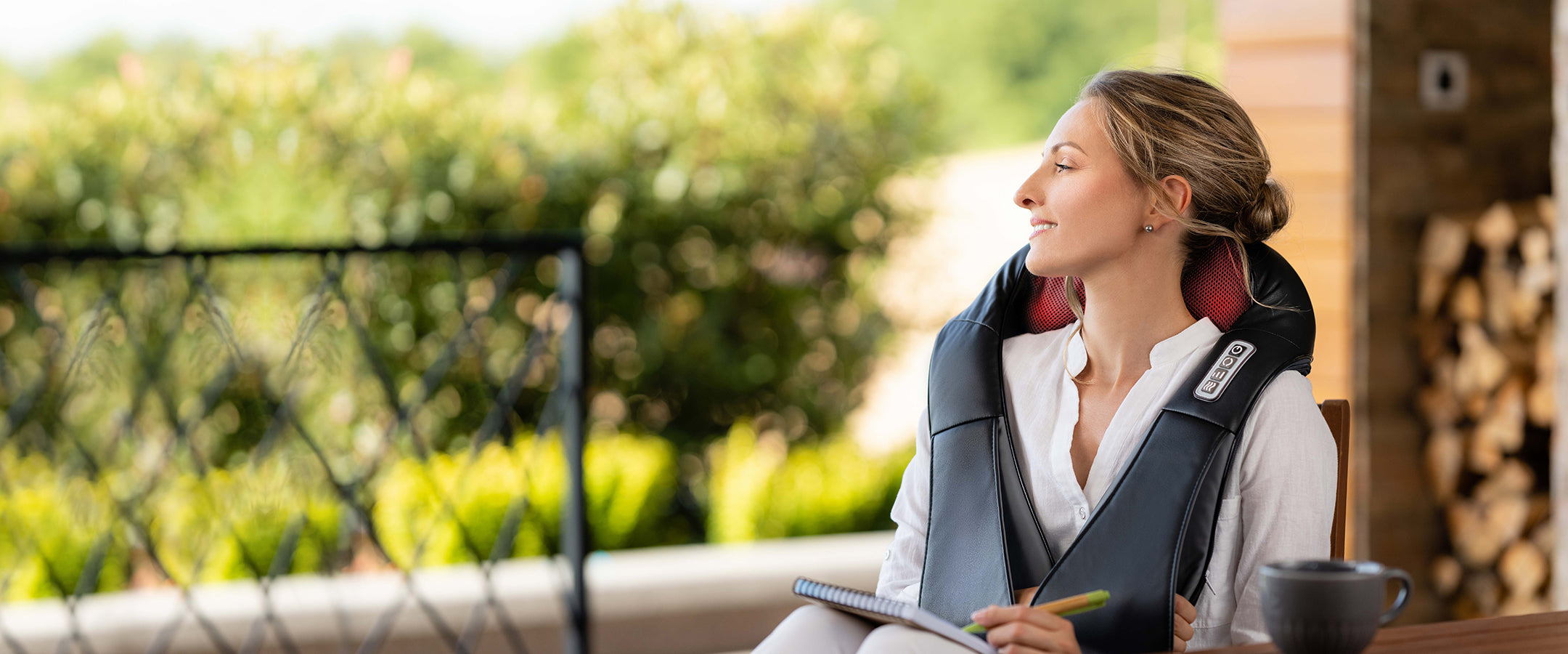 woman relaxing with electric massager for neck pain relief
