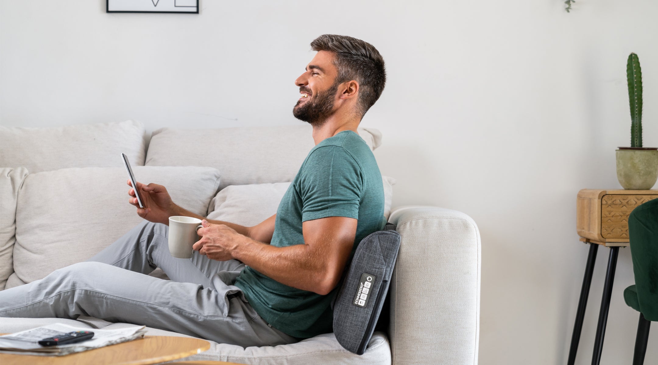 man lying on bed indulging in soothing back massage with back massage pillow