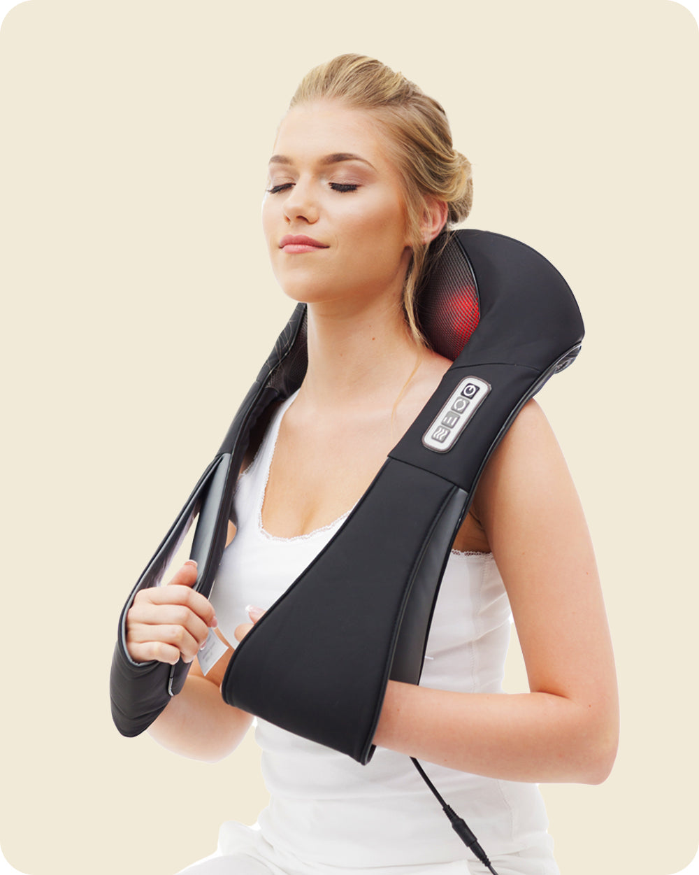 woman relieving neck pain with massager with heat
