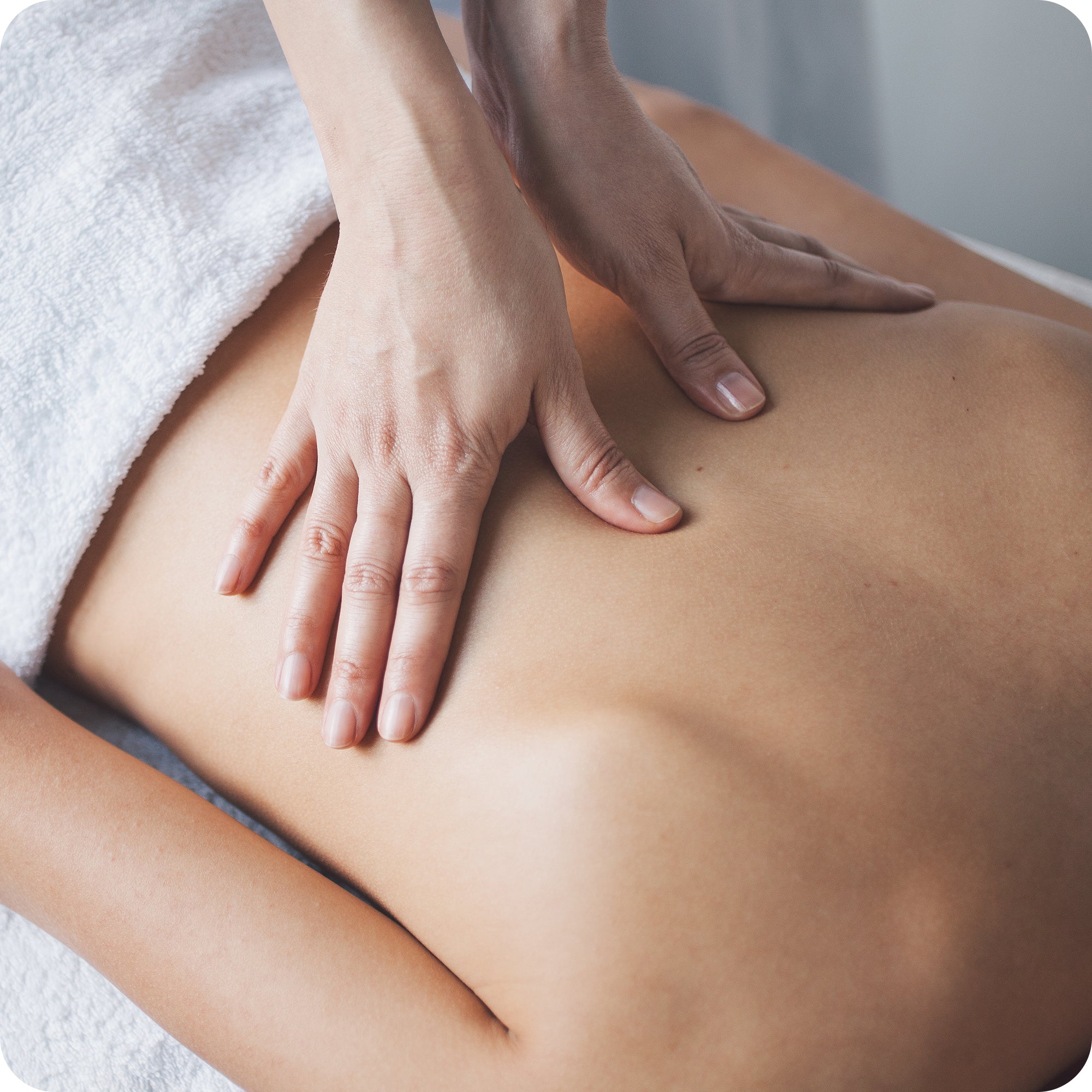 professional masseur giving shiatsu massage on the back muscles